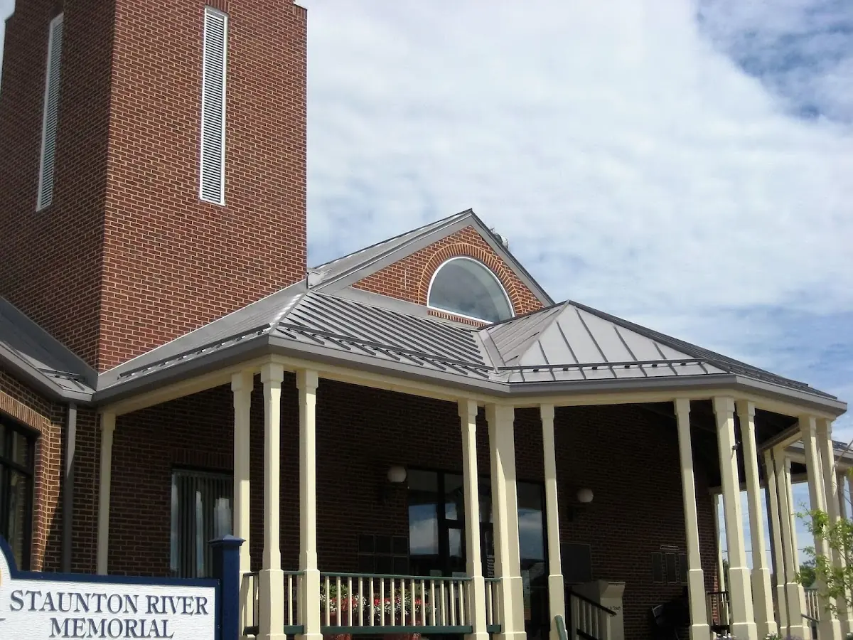 Skilled roofing craftsmen working on a residential roof in Montgomery